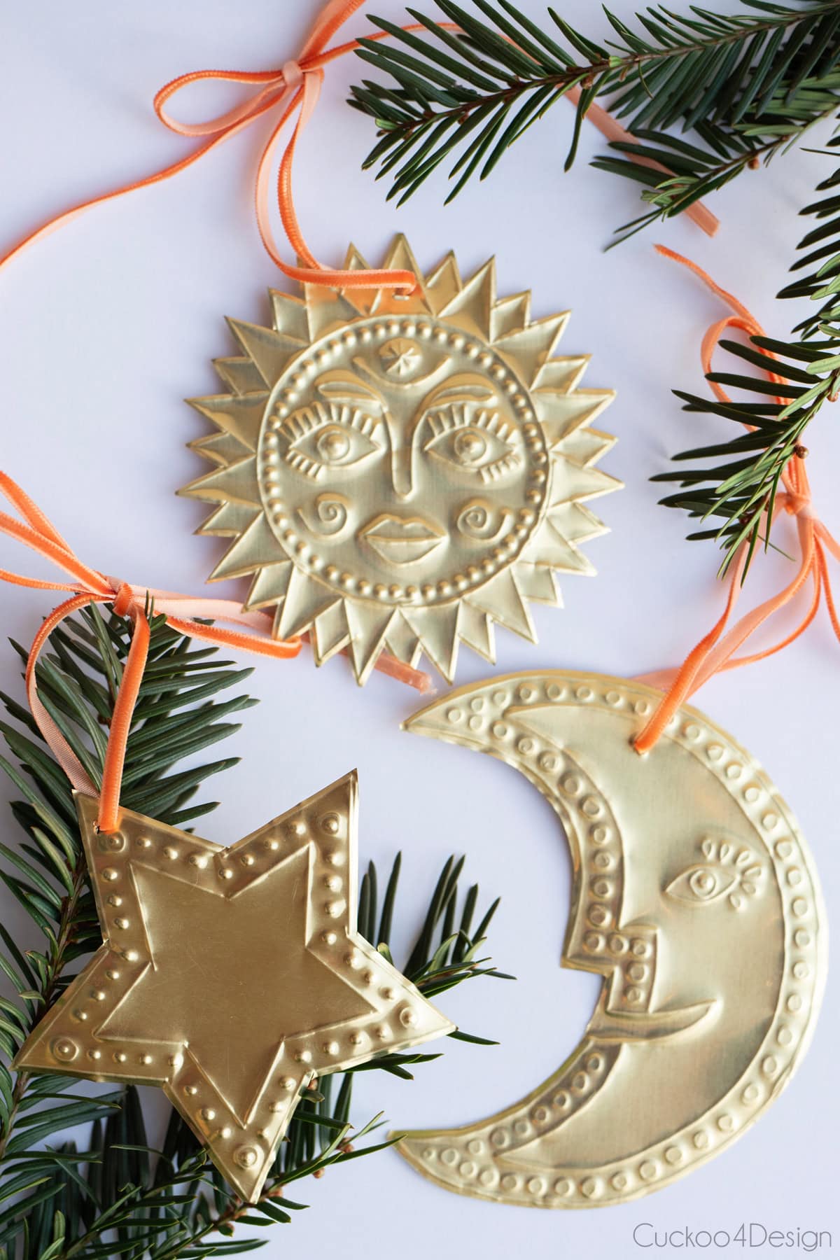 sun, moon, and stars embossed ornaments