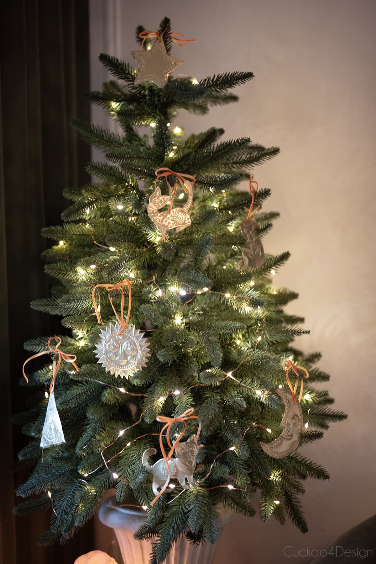 small dining room Christmas tree decorated with DIY embossed tin ornaments