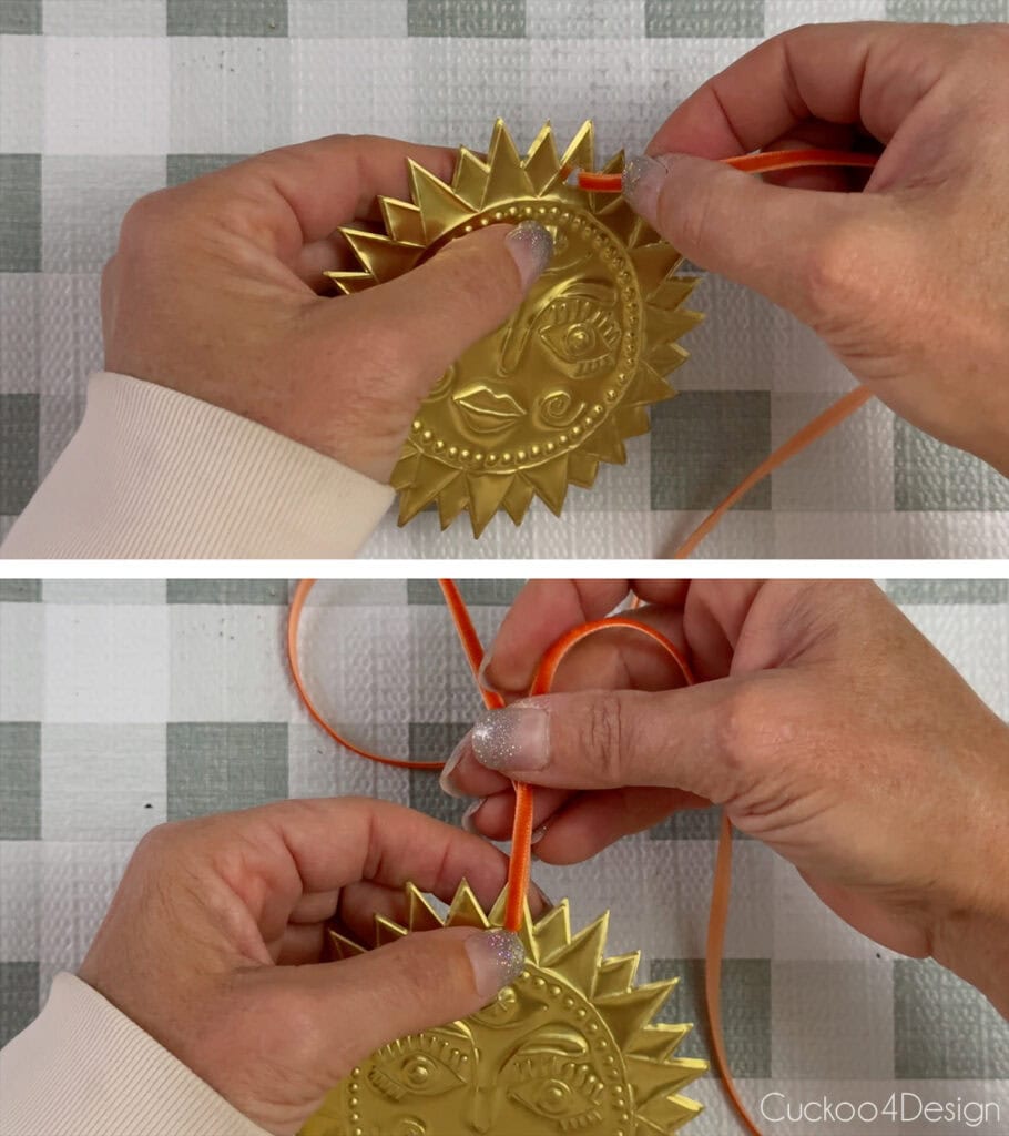 threading ribbon through the embossed ornament hole