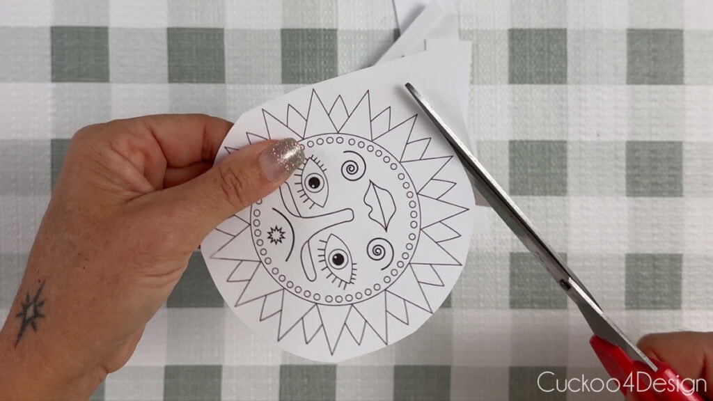 cutting out template with scissors