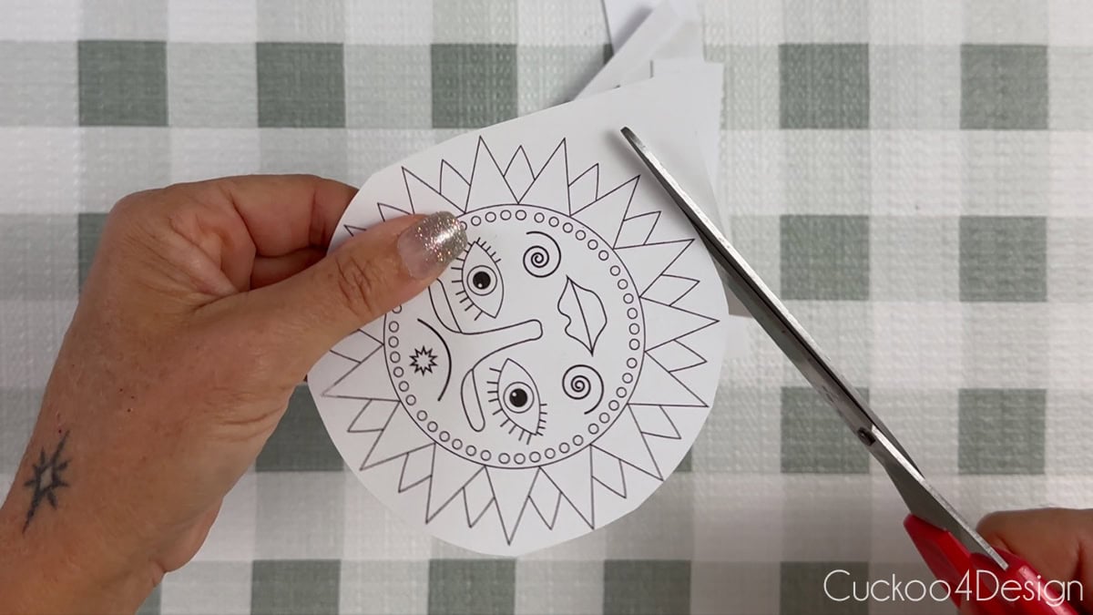 cutting out template with scissors