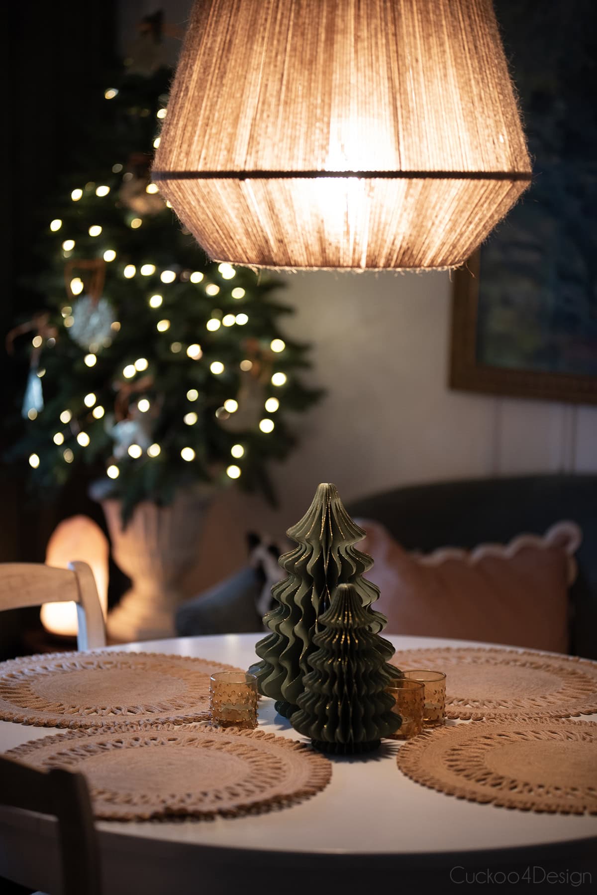 our dining room with asmall Christmas tree with embossed ornaments