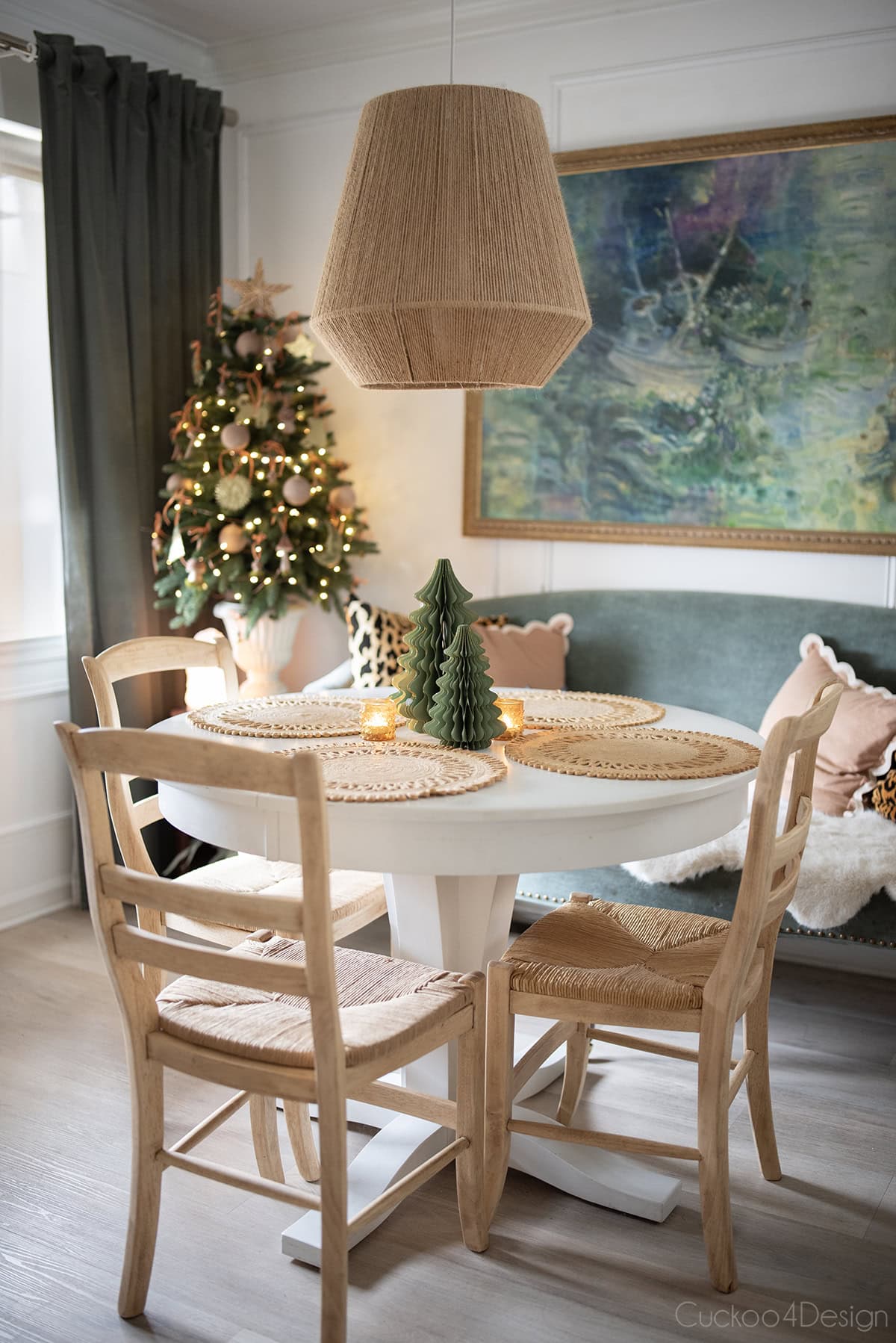dining room with dark green accents and small Christmas tree