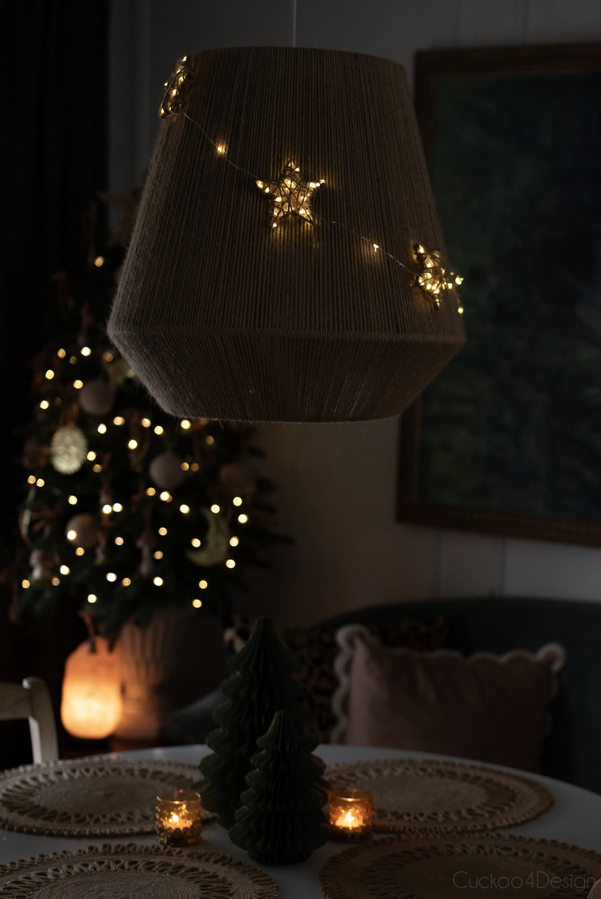 close-up view of DIY yarn stars in the dark with lights on