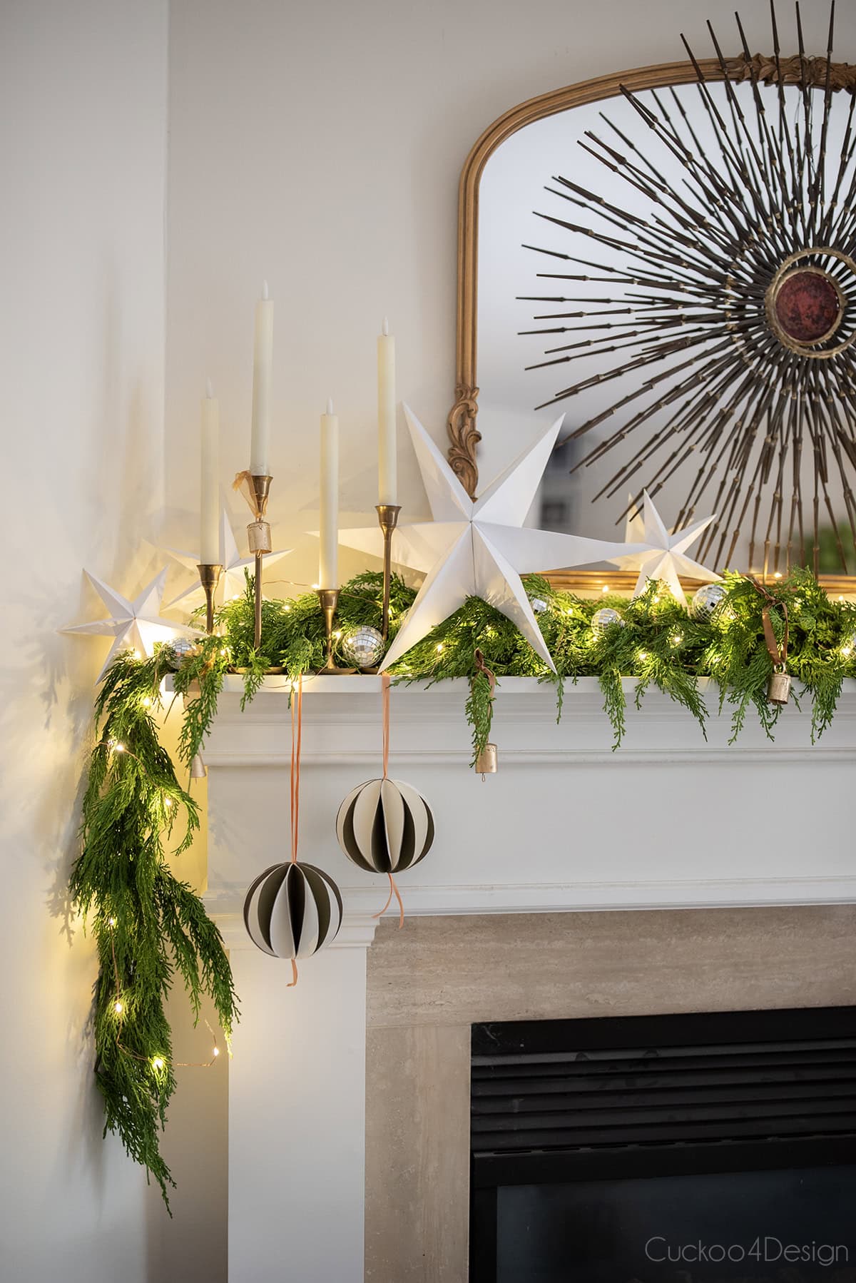 mantel with folded paper stars and DIY honeycomb ornaments