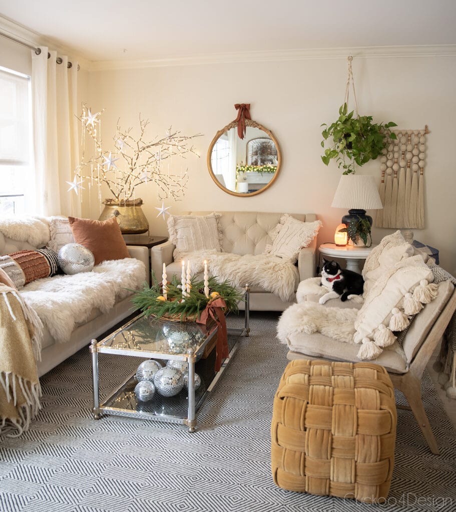full living room view with eclectic touches and ivory, rust colored accents