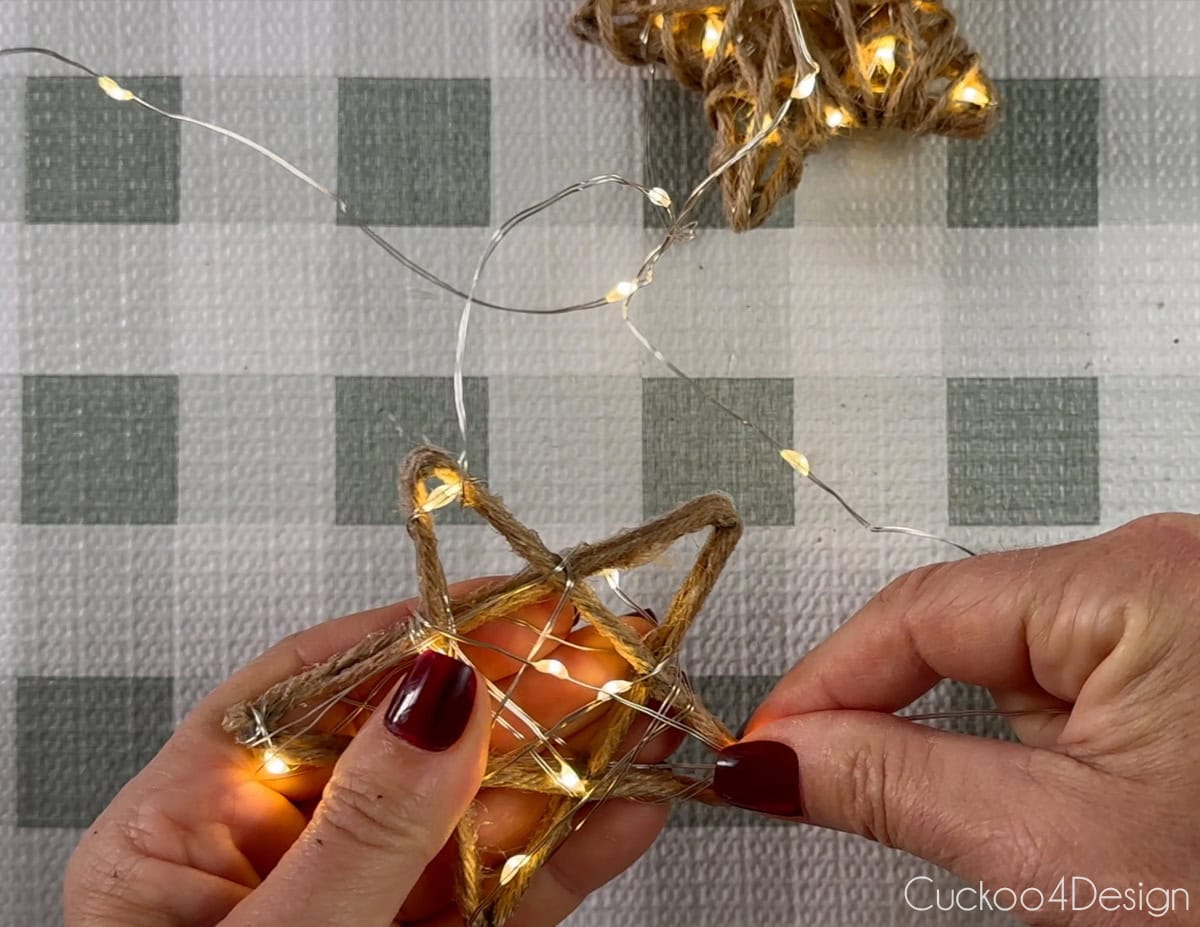 wrap more star shapes with fairy lights and yarn