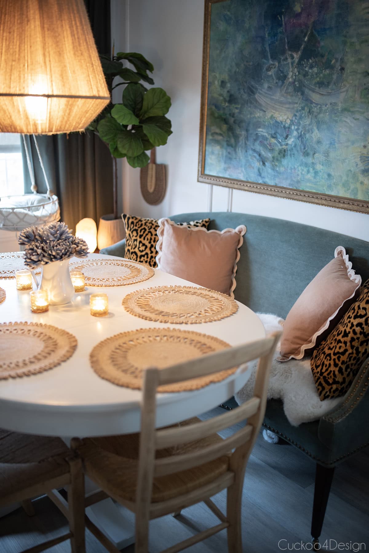 eclectic dining room with white oval table, lots of texture, and eclectic touches