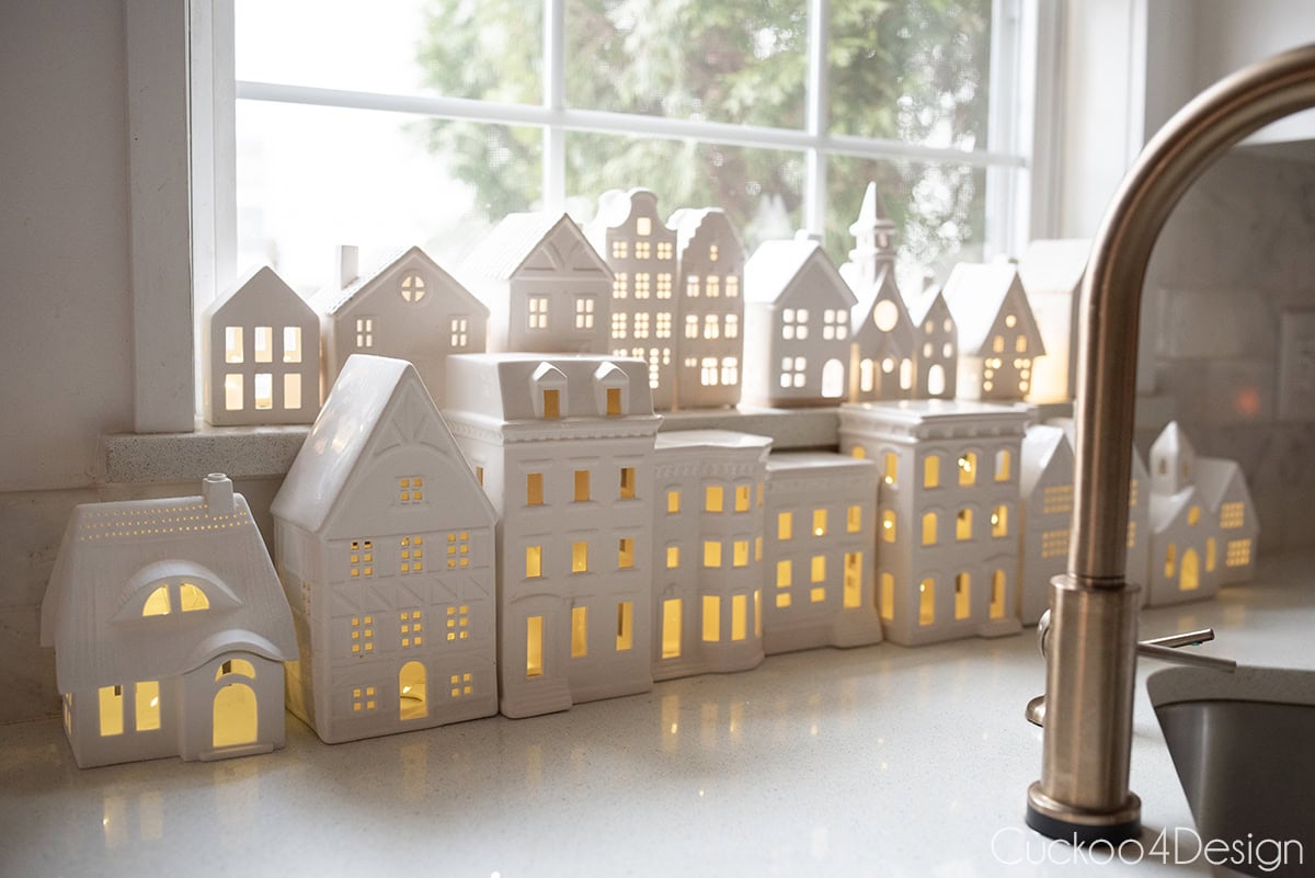 white ceramic houses as window display