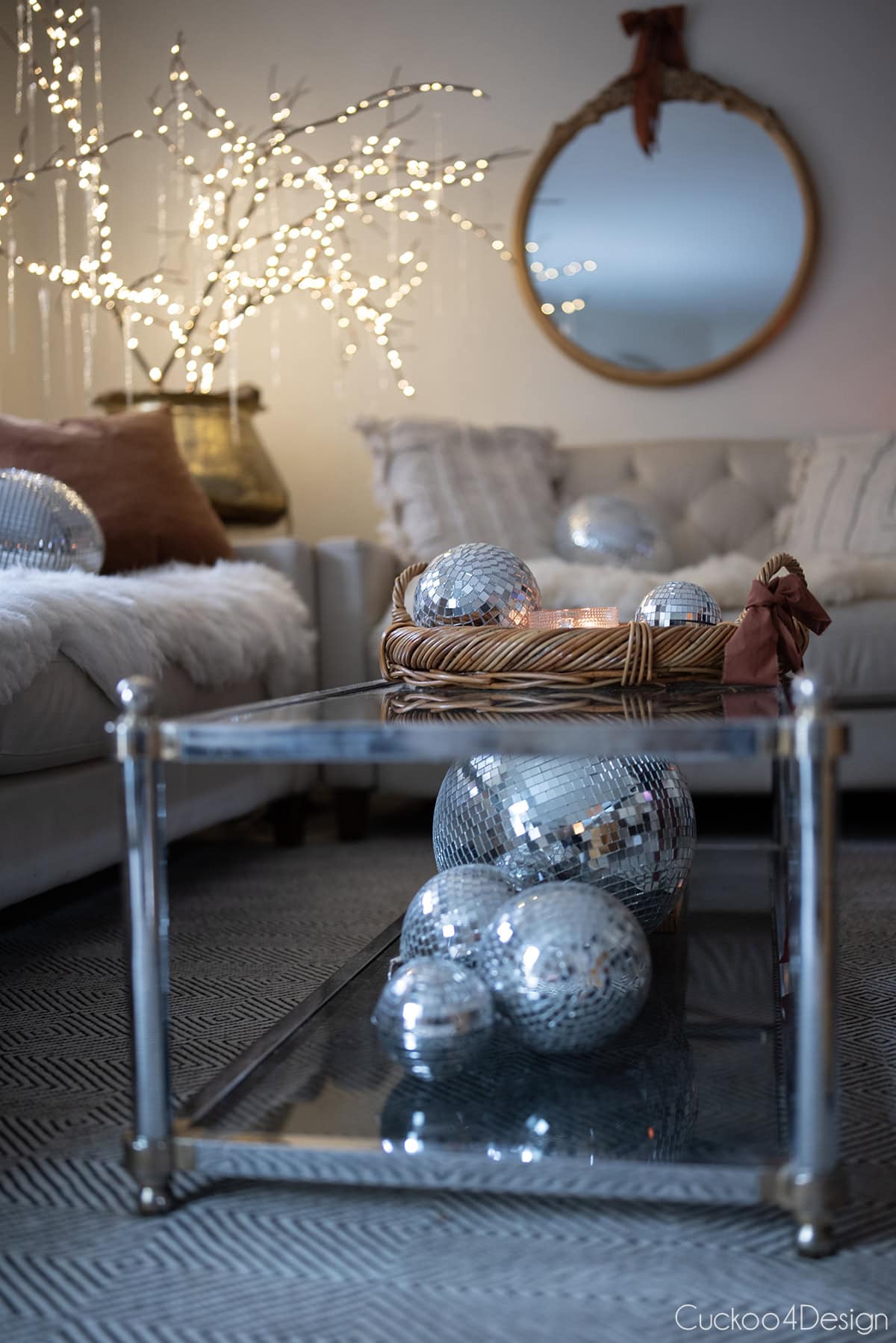 front view of coffee table with disco balls and icicle branches