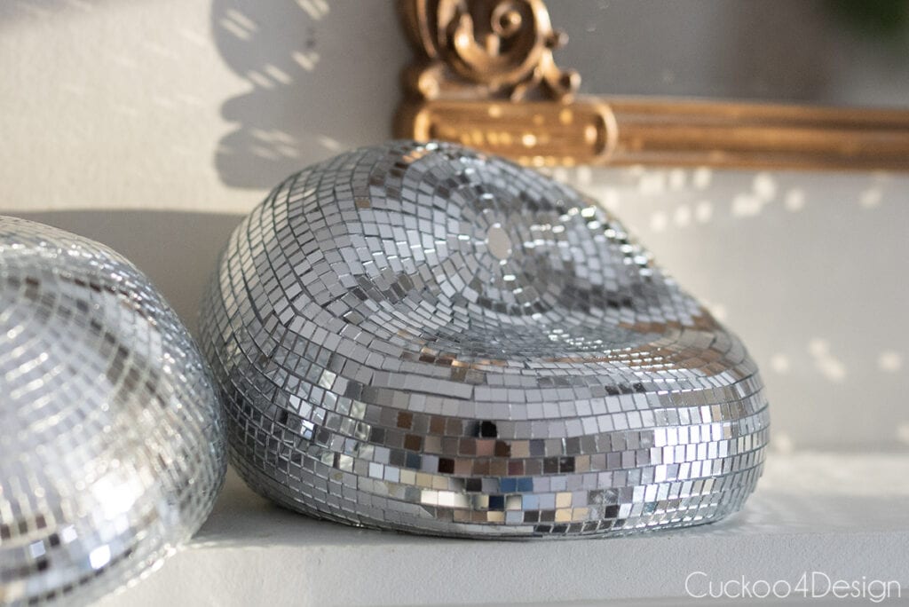 side view of disco ball that is melted inward