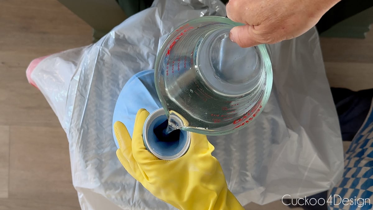 adding water to the plaster filled balloon