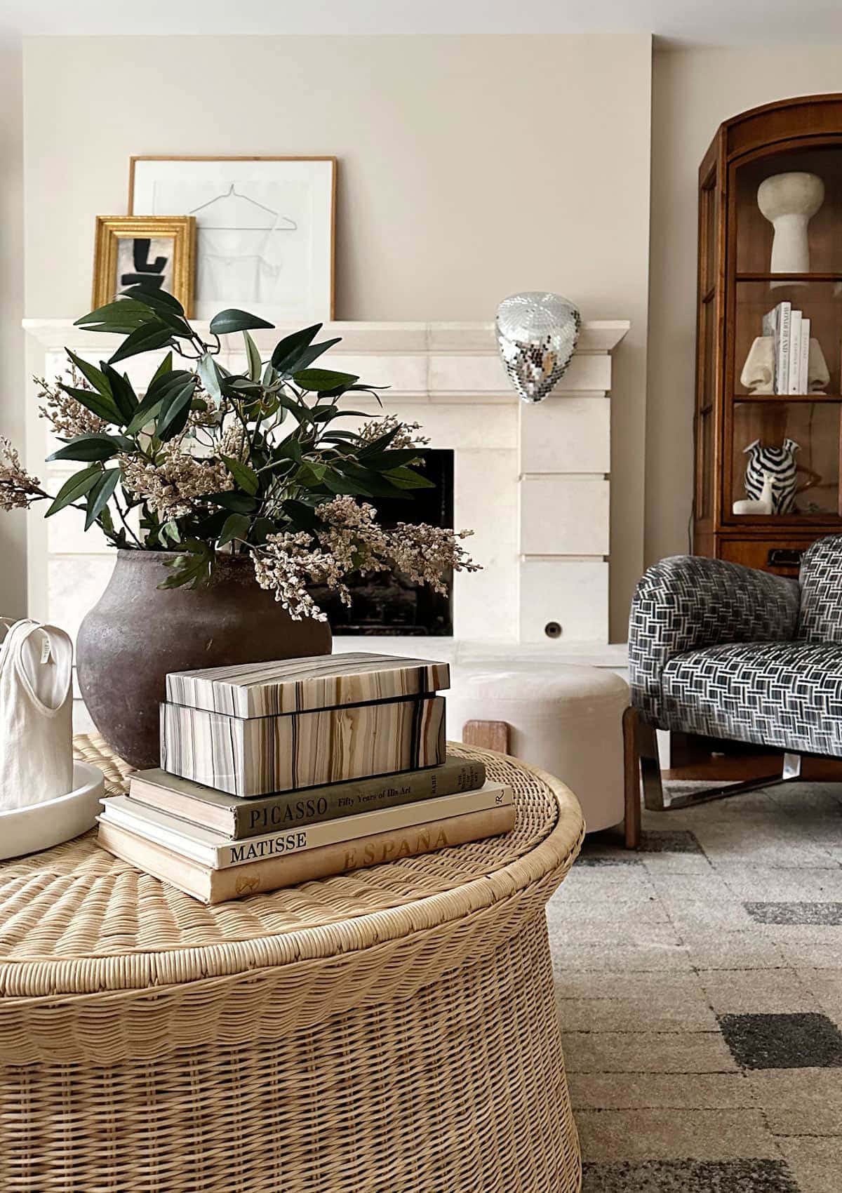large melted disco ball on fireplace mantle in elegant living room