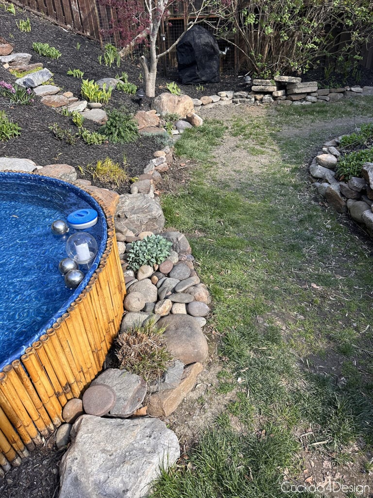 backyard stock tank pool area before removing terrible grass