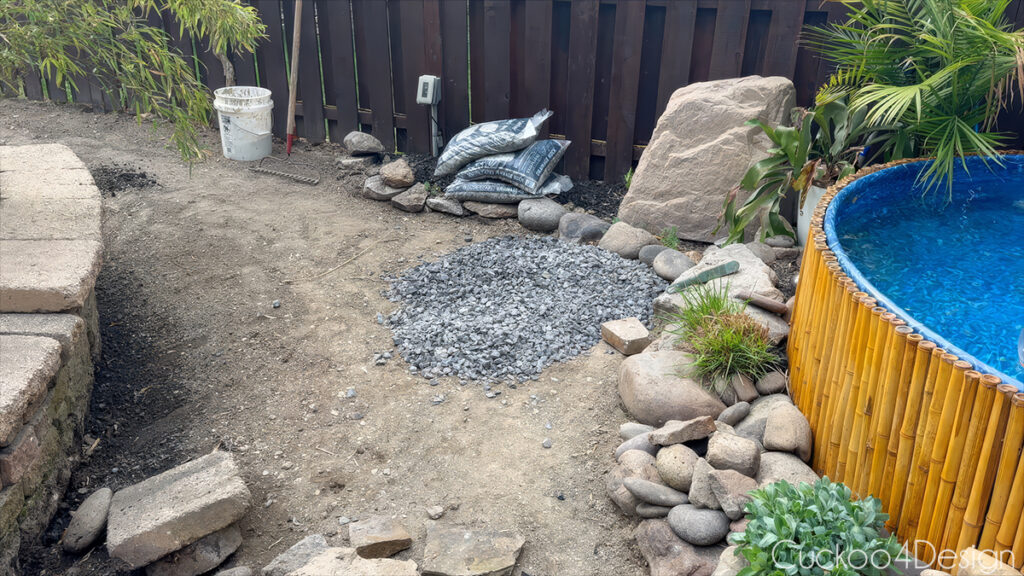 trench dug along rock wall with previous drainage issues