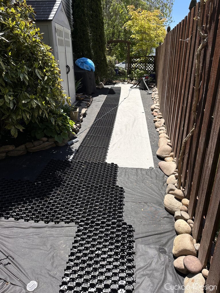 gravel grid walkway over landscaping fabric before adding pea gravel
