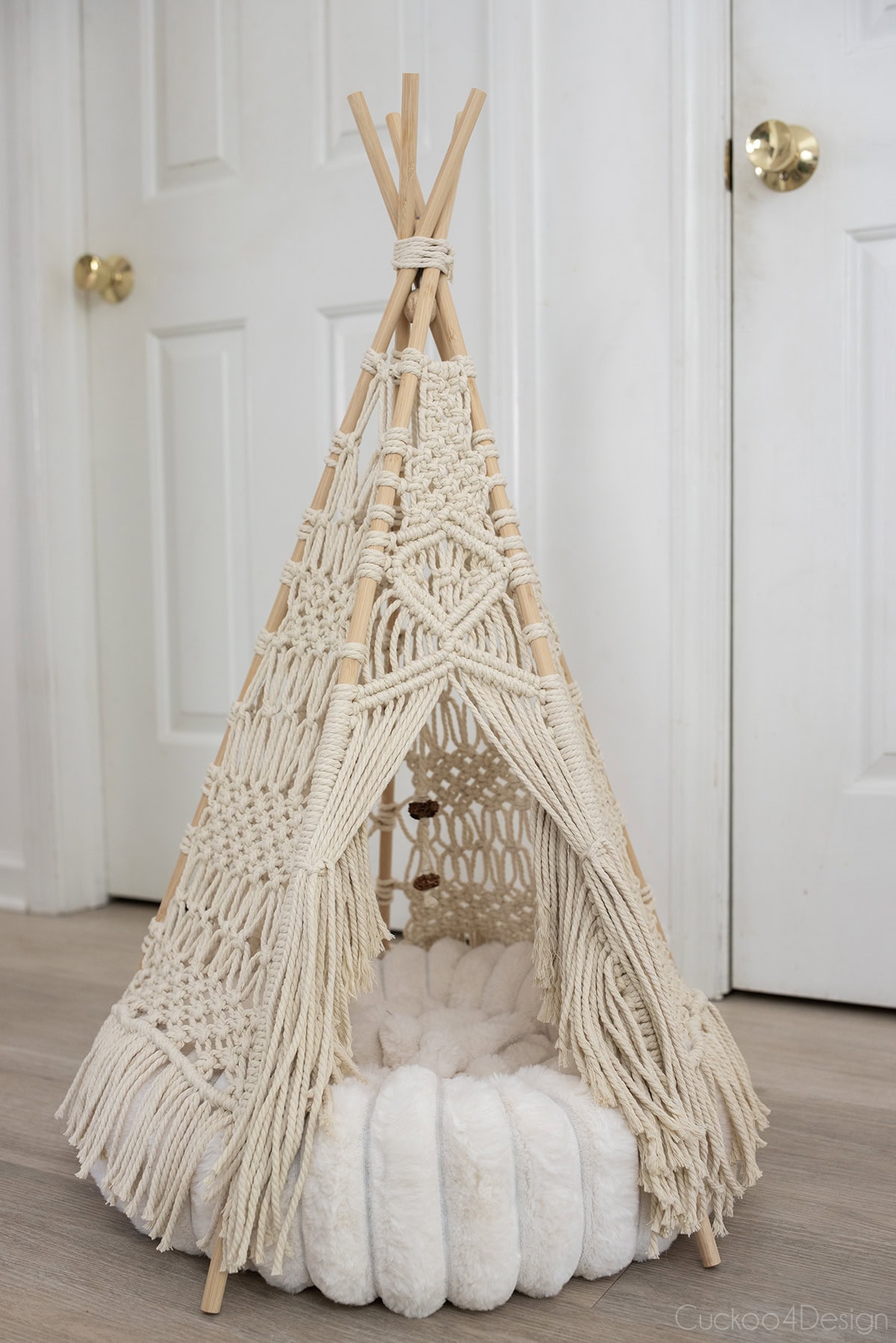 finished macrame teepee with plush round pet bed inside