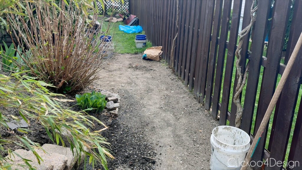 side yard view with grass partially removed