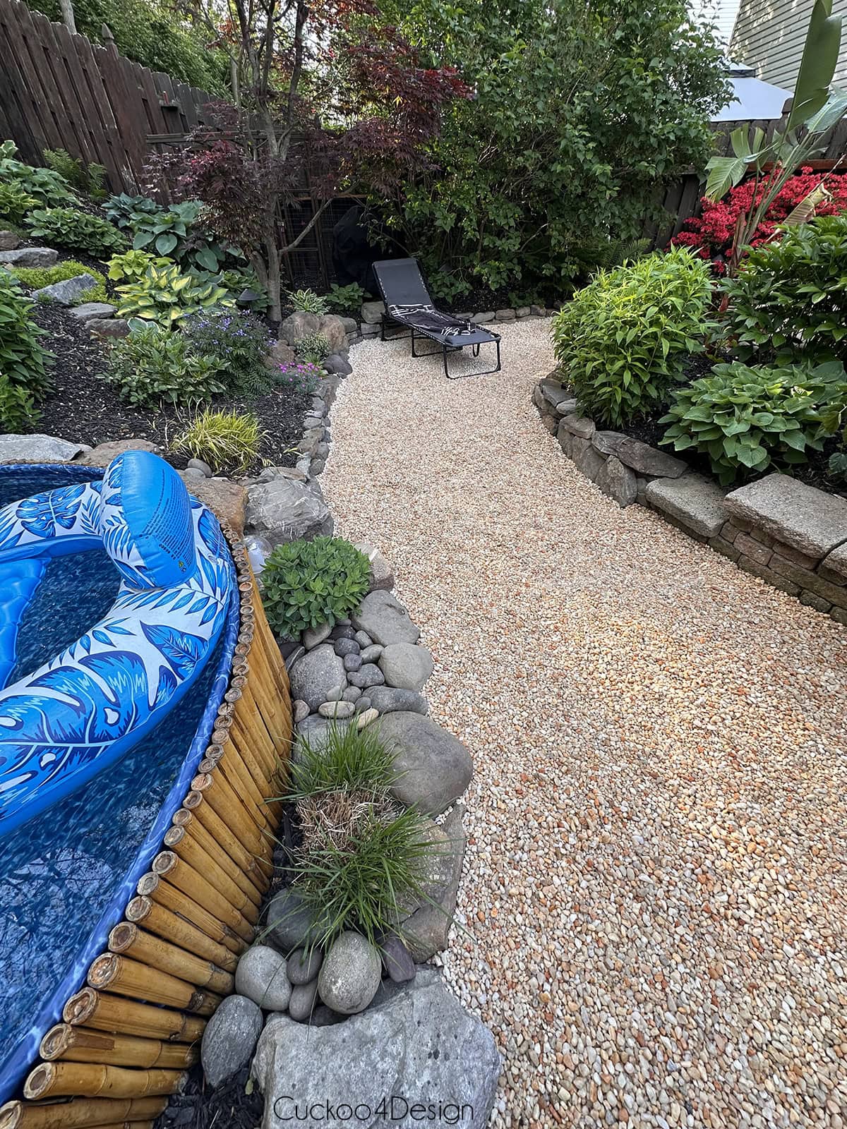 view of gravel with old lounge chair placed on it