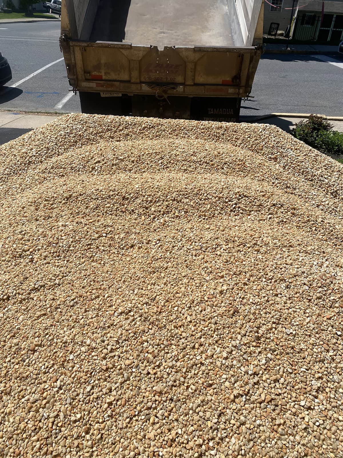 a dump truck load full of 8 tons of pea gravel
