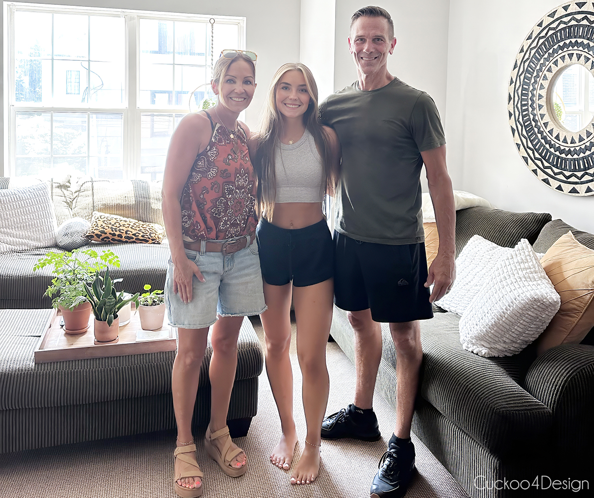 our family standing in my daughter's college apartment