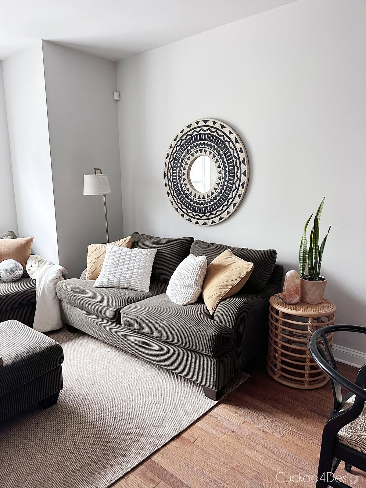 discontinued fixed-frame Raymour & Flanigan Maverick two-seater sofa styled in a college apartment