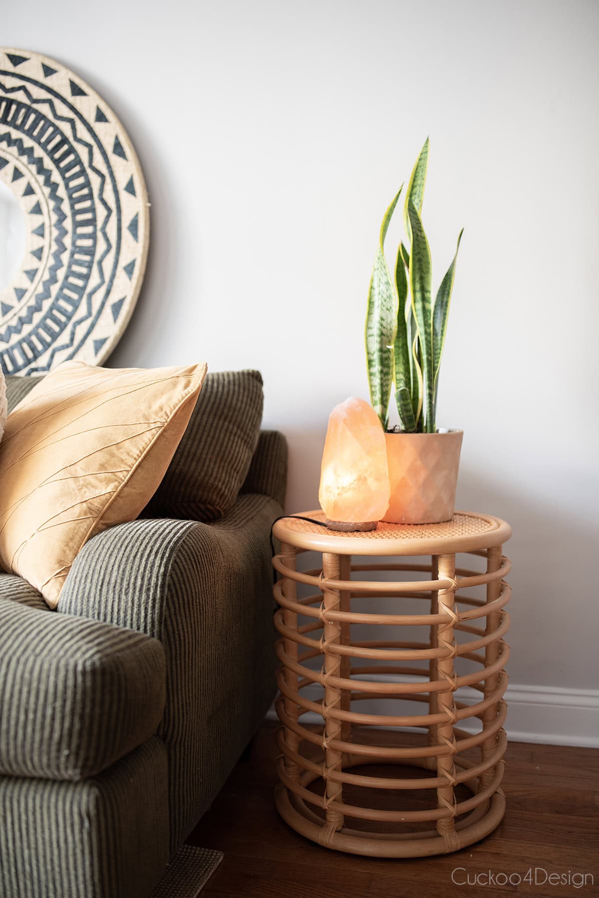 rattan Target Threshold Vass accent table next to green sofa