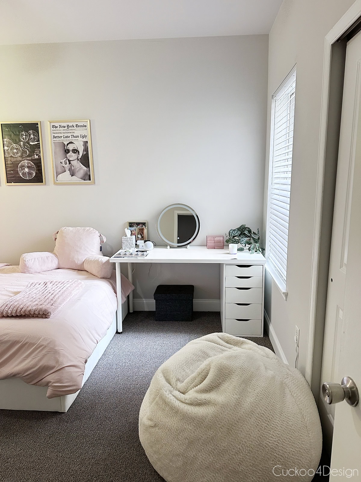 white Ikea desk and Lowe's blinds in decorated college apartment with blush accents