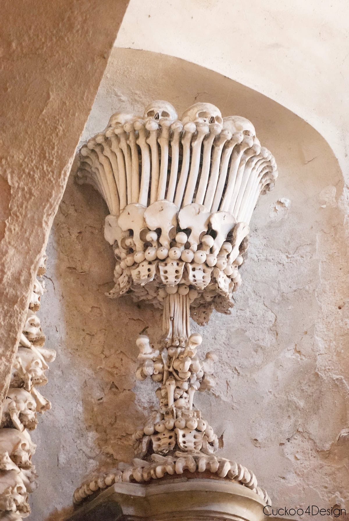 Chalice made of human bones and skulls on a wall inside the Sedlec Ossuary in Kutná Hora